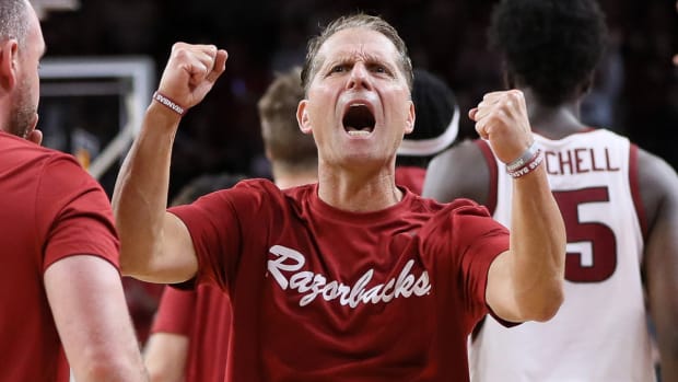 Razorbacks coach Eric Musselman celebrates exhibition win over Purdue on Saturday